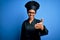 Young african american chef woman wearing cooker uniform and hat over blue background smiling friendly offering handshake as