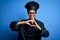 Young african american chef woman wearing cooker uniform and hat over blue background smiling in love doing heart symbol shape