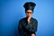 Young african american chef woman wearing cooker uniform and hat over blue background thinking looking tired and bored with