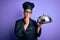Young african american cooker girl wearing uniform and hat holding tray with dome cover mouth with hand shocked with shame for