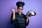 Young african american cooker girl wearing uniform and hat holding tray with dome screaming proud and celebrating victory and