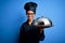 Young african american cooker woman wearing uniform holding waiter tray with dome with a happy face standing and smiling with a