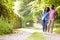 Young African American Couple Walking In Countryside