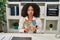 Young african american doctor woman holding australian dollars banknotes puffing cheeks with funny face