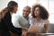 Young african american family couple meeting mixed race agent.