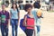 Young african american female student waiting for bus