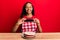 Young african american girl wearing baker apron making carrot cake picture smiling with a happy and cool smile on face