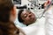 Young African American male patient at chair at dental clinic. Medicine, health, stomatology concept. dentist conducts