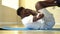 Young African American man doing sit-up exercise on yoga mat at gym. Male fitness model performing crunch at fitness