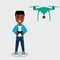 Young African American man flying drone with remote control. Smiling character controls aerial drone with a camera.