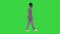 Young african american man in grey casual clothes walking on a Green Screen, Chroma Key.