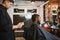 Young African-american man visiting barbershop