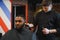 Young African-american man visiting barbershop