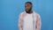 Young african american man wearing casual shirt standing over isolated white background doing happy thumbs up gesture