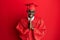 Young african american man wearing graduation cap and ceremony robe praying with hands together asking for forgiveness smiling