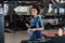 young african american mechanic standing underneath