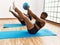 Young african american sporty couple training pilates using ball at sport center