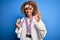 Young african american sporty woman with curly hair doing sport winning medals doing ok sign with fingers, excellent symbol