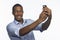 Young African American taking a selfie picture with smartphone, horizontal