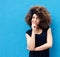 Young african american woman with afro thinking