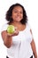Young african american woman giving an green apple