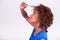 Young African American woman holding her frizzy afro hair - Blac