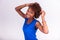 Young African American woman holding her frizzy afro hair - Blac