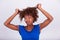 Young African American woman holding her frizzy afro hair - Blac