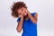 Young African American woman holding her frizzy afro hair - Blac