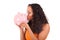 Young african american woman kissing piggy bank