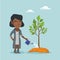 Young african-american woman watering a tree.
