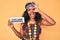 Young african american woman wearing bohemian and hippie style holding you are magical message smiling happy doing ok sign with