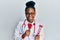 Young african american woman wearing doctor uniform holding tuning fork smiling with a happy and cool smile on face