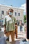 Young african american woman wearing mask waiting to collect her order or purchase from the pickup point during