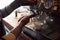 Young African barista pouring expresso behind a cafe counter