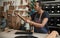 Young African female artisan working in her leather studio