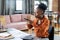 Young African female auditor taking photo of financial papers