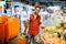 Young african man buying vegetables and fruits in grocery section at supermarket. Black man choose vegetables and fruits