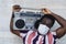 Young African man holding vintage boombox having fun outdoor - Black man wearing face mask while listening music with stereo