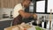 Young african man preparing boiled chicken mince with vegetables recipe.