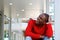 Young african man sitting and laughing outside