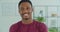 Young african man standing at home and smiling. Portrait nice looking attractive african american man posing with happy