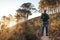 Young African man standing on a trail in the afternoon