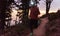 Young African man wearing a headlamp jogging at dusk