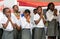 Young African school girls performing morning prayer