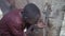 Young African schoolboy drinking fresh clean water, poverty symbol