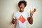 Young afro american man holding China Chinese flag standing over isolated white background very happy and excited, winner