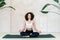 Young afro american woman sitting in meditation pose