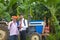 Young agronomist and farmer showing thumps up after discussion