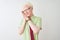 Young albino businessman wearing shirt and tie standing over isolated white background sleeping tired dreaming and posing with